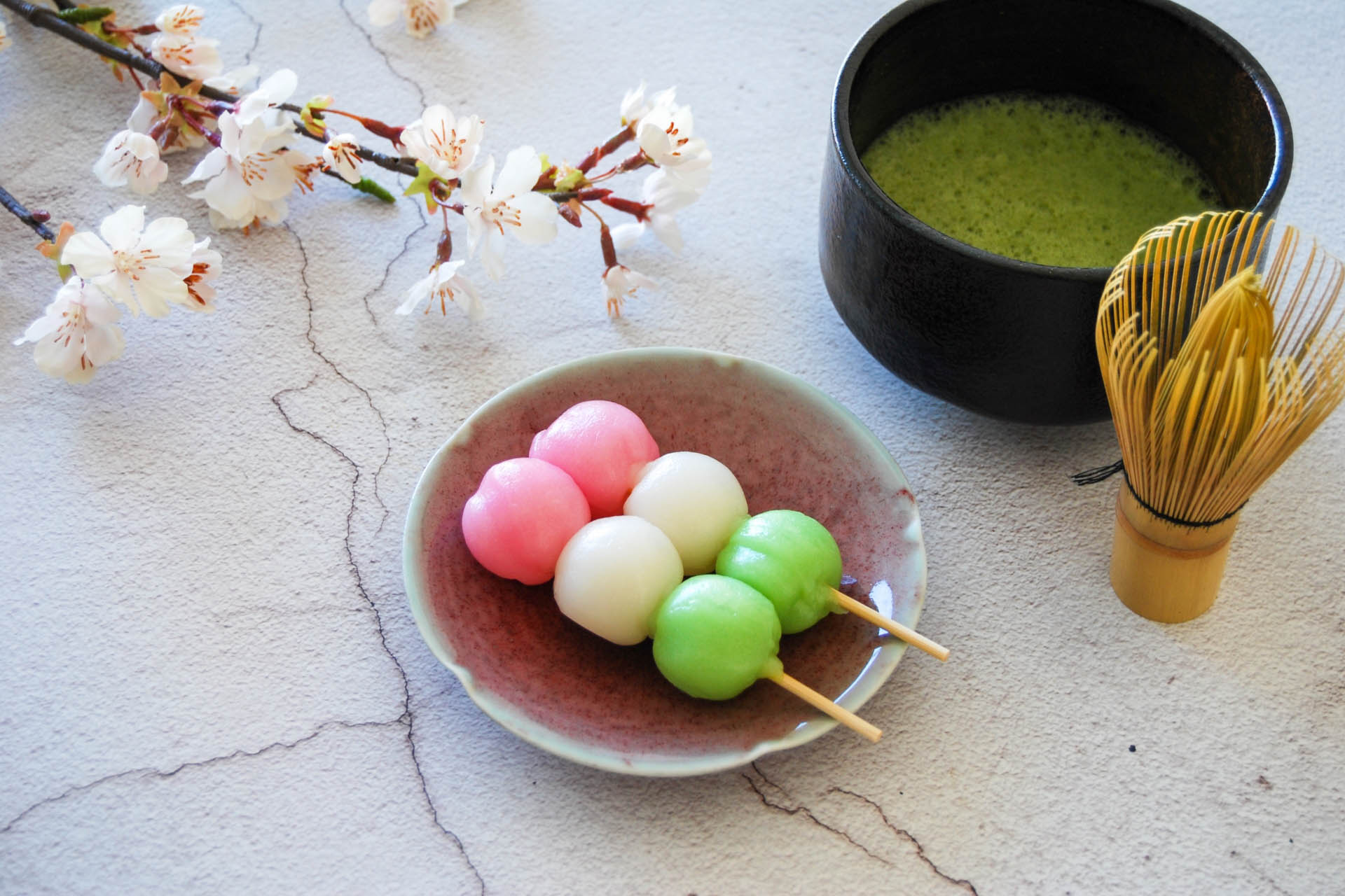 Fresh green tea leaves growing under blue sky in a Japanese tea field